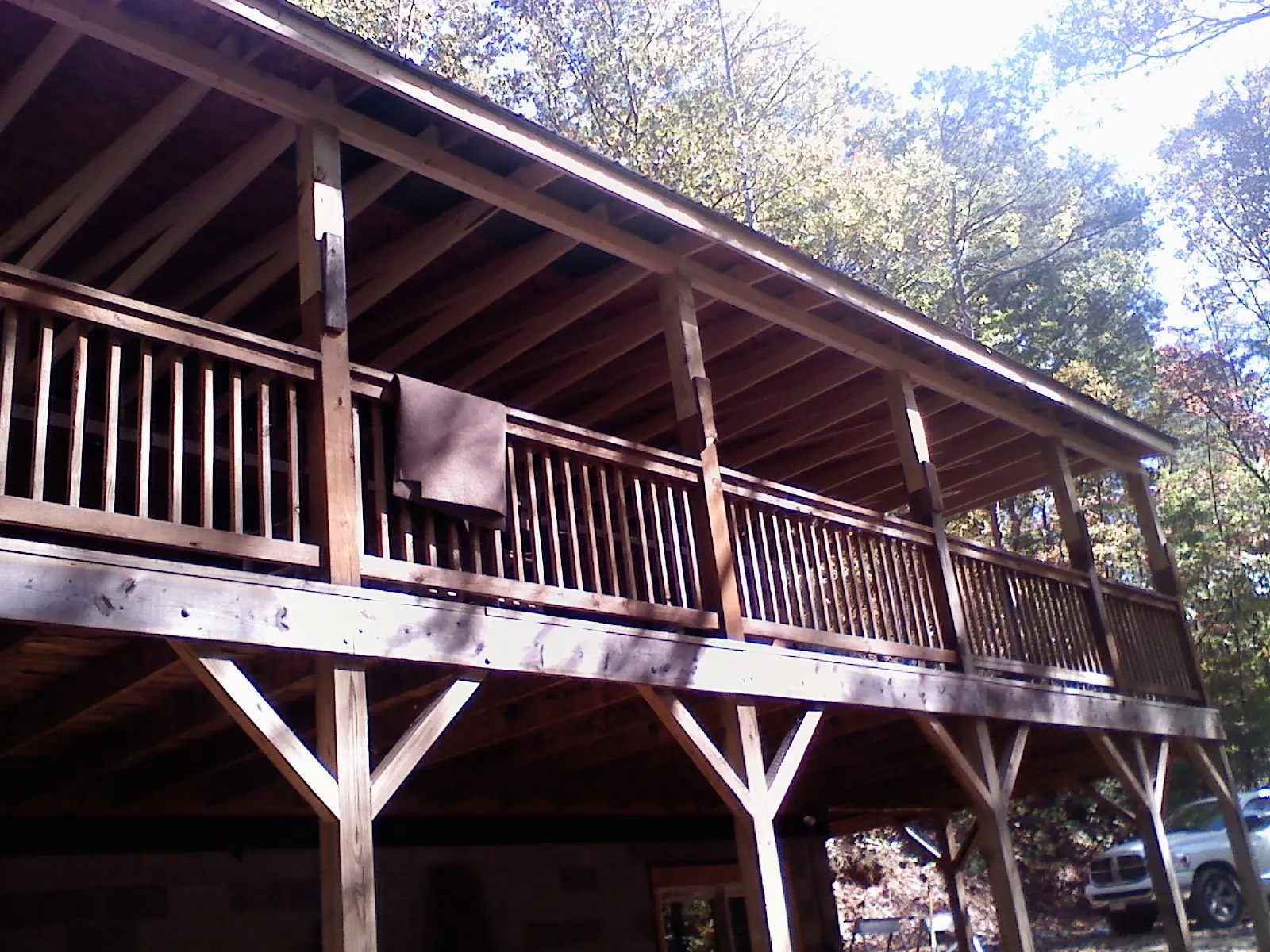 Timber framing under a new elevated porch and deck — Roof Leak Repair in Amesville by Roofing Brothers